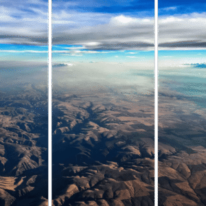 Abstract Landscape Fine Art titled Earth and Sky, aerial view of rugged terrain and blue sky.