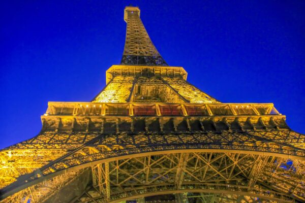 Architectural Fine Art titled Iron Geometry, an upward view of the Eiffel Tower structure.