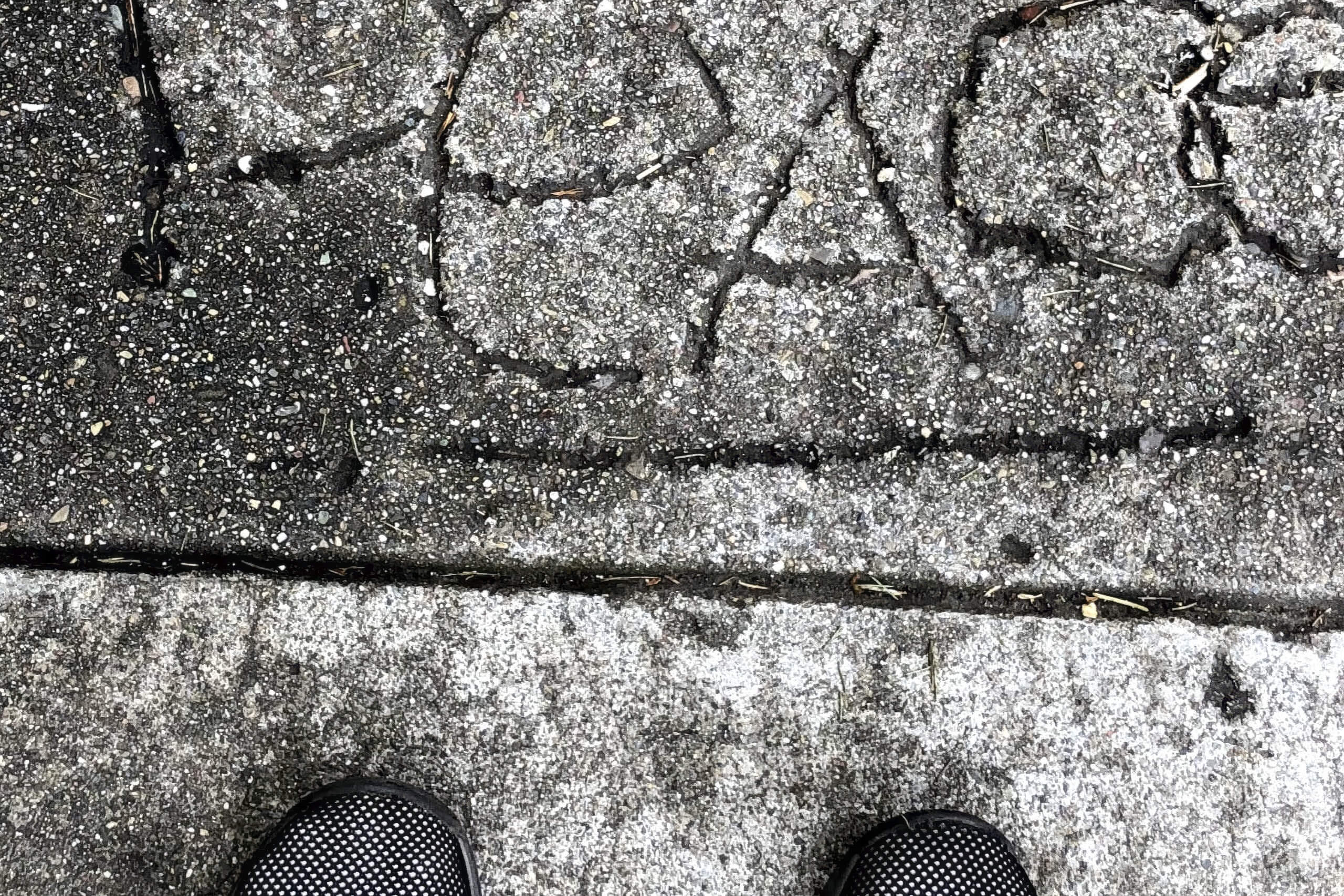 Street Photography Fine Art titled Finding Peace, showing sidewalk graffiti of the word PEACE.