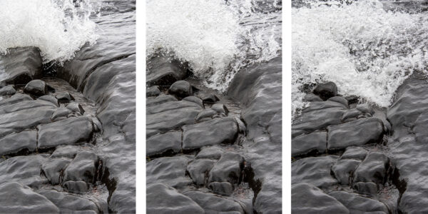 Lake superior triptych print showing a three-part wave progression surging through dark basalt rock on Brighton Beach.